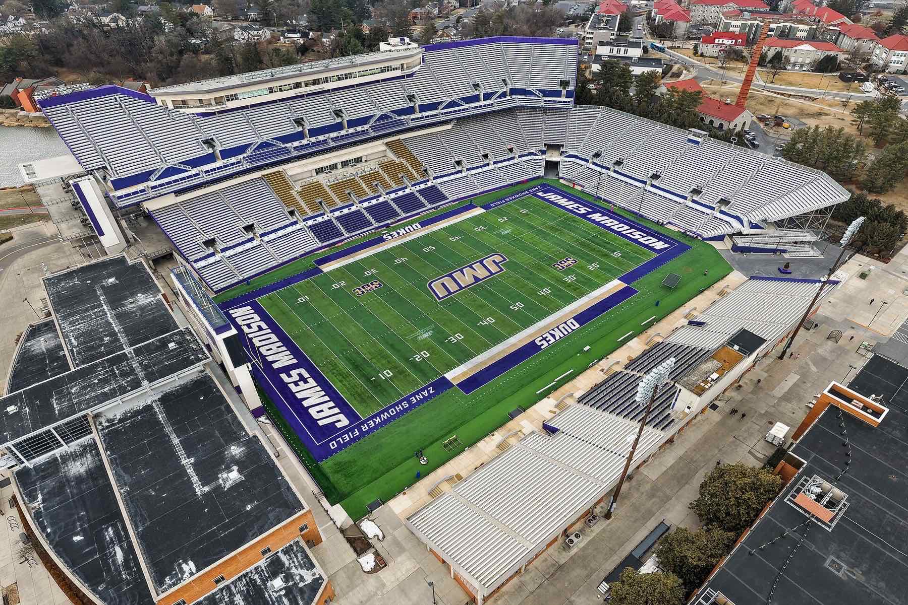 Aerial view of Bridgeforth Stadium at JMU with the field marked James Madison and Dukes