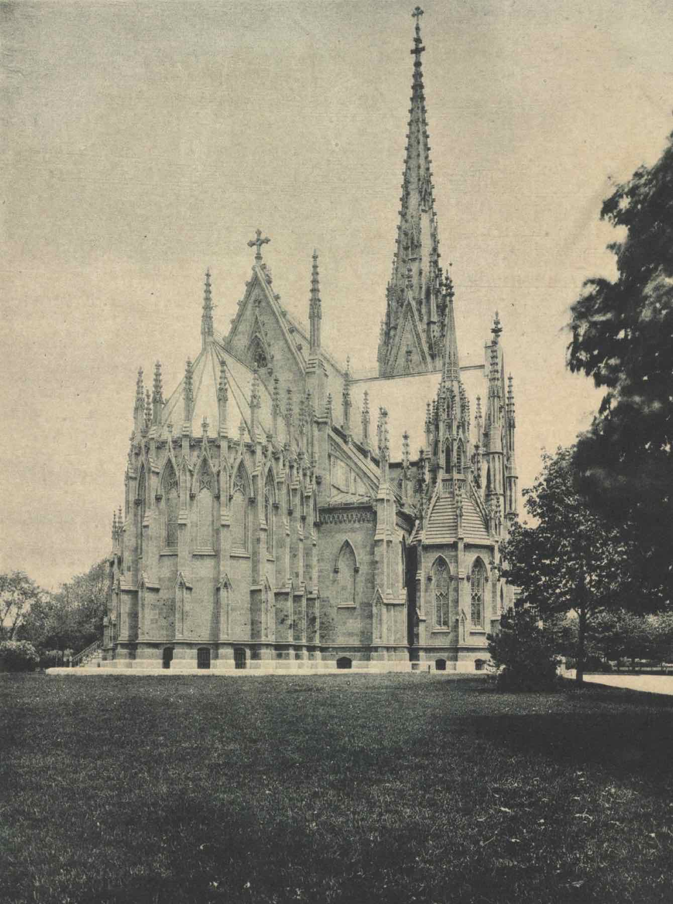 Archival photograph of the Cathedral of the Incarnation in Garden City, with its tall spire over an open lawn
